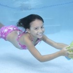 Kelly swimming underwater