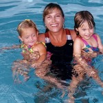 Jackie teaching swim lessons to children at Westminster Academy