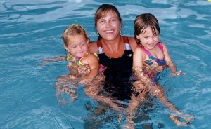 Jackie teaching swim lessons to children at Westminster Academy